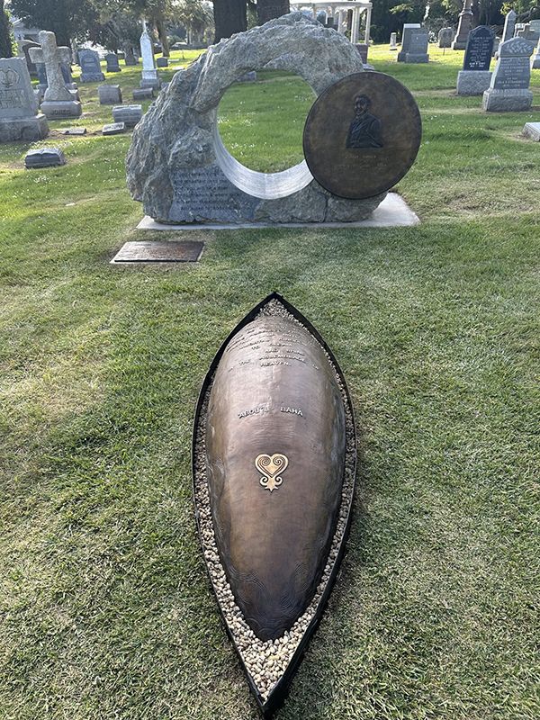 A two part sculpture that serves as a monument to Robert Turner, the first African American Baha'i