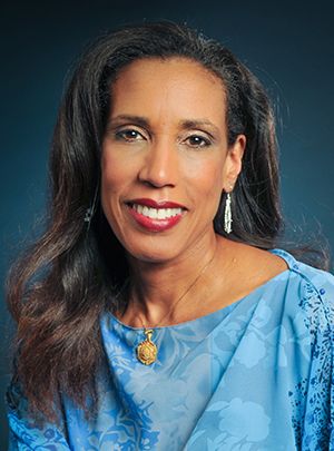 Dr. Lisa Merritt, an attractive African American woman